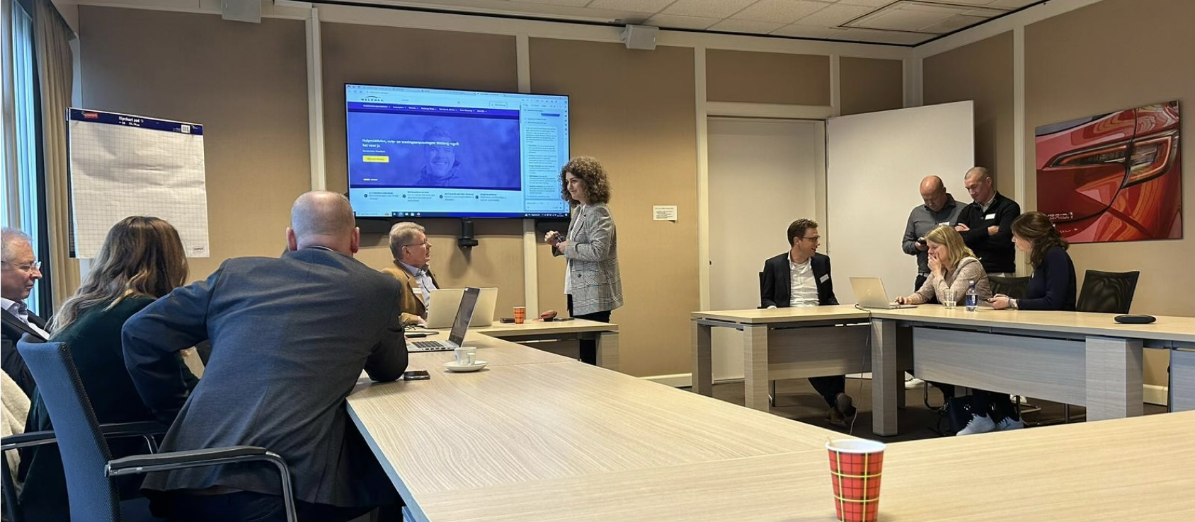 Sophie presenting an AI workshop at Louwman